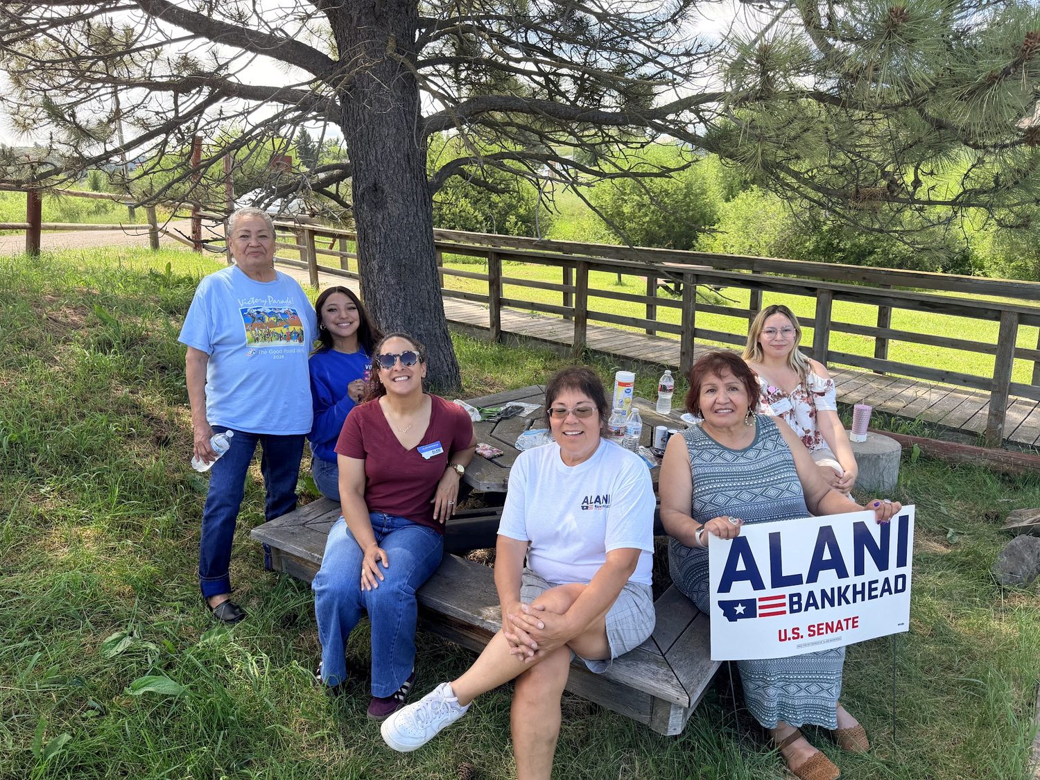 Montana supporters holding an Alani Bankhead for U.S. Senate sign at a community event